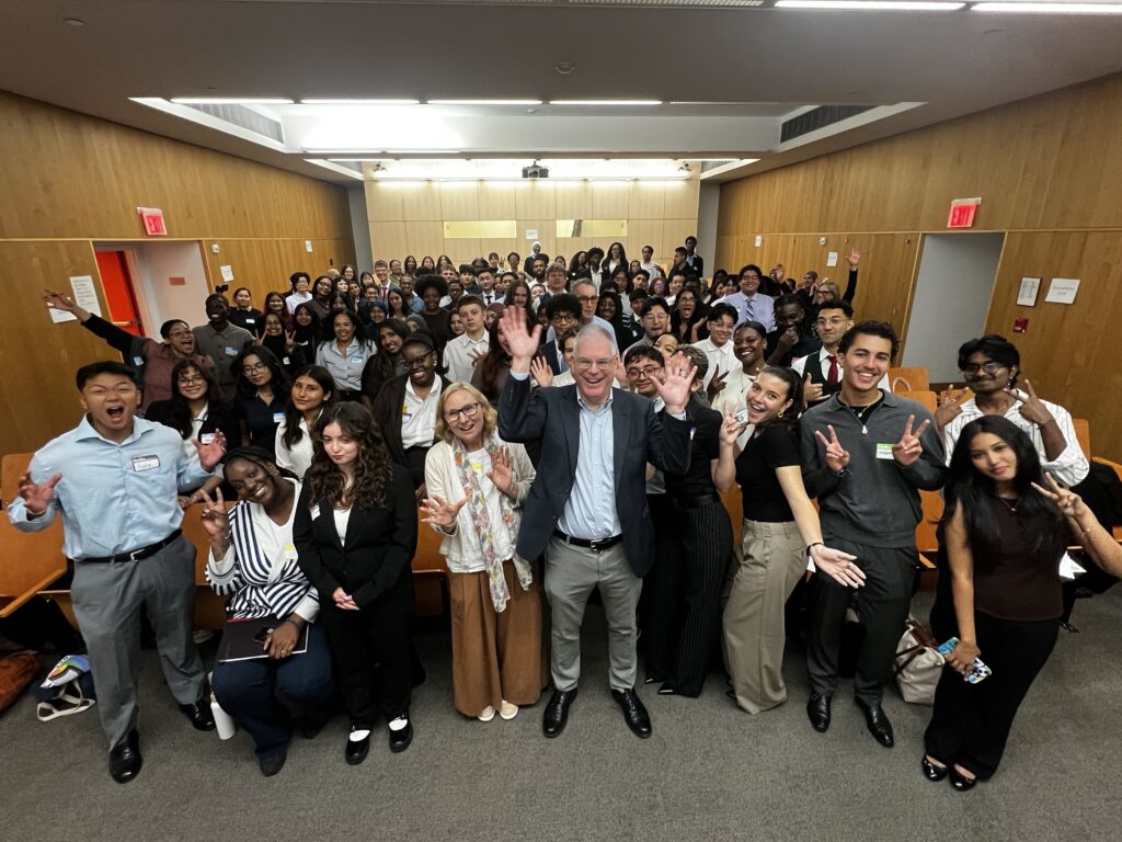 Dean Ostfield poses with Powell School Fellows